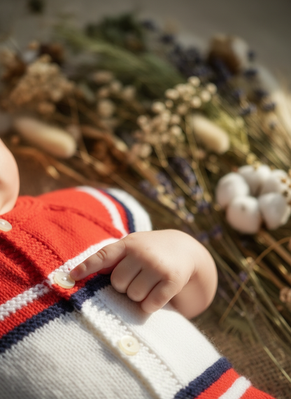 Baby's hands with botanicals
